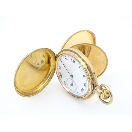 833 - A gold plated Hunter cased pocket watch, the case marked Dennison Watch Case Co. and 'Star' . Togeth... 