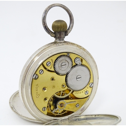 834 - An Omega half hunter silver pocket watch with blue enamel numerals  and engine turned decoration. Th... 