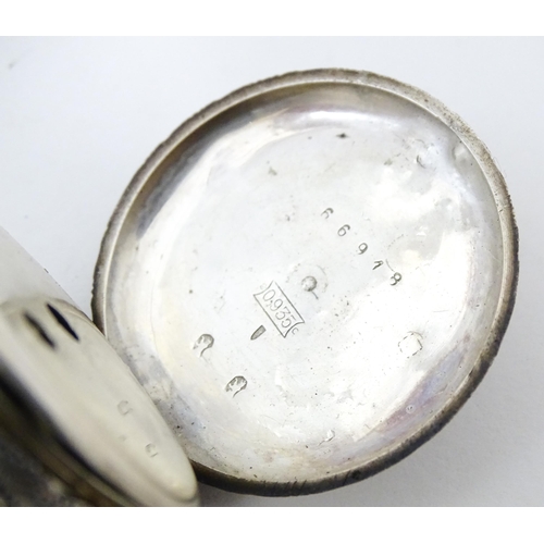 839 - A Continental .935 silver fob watch with engraved decoration and white enamel dial with gilt highlig... 