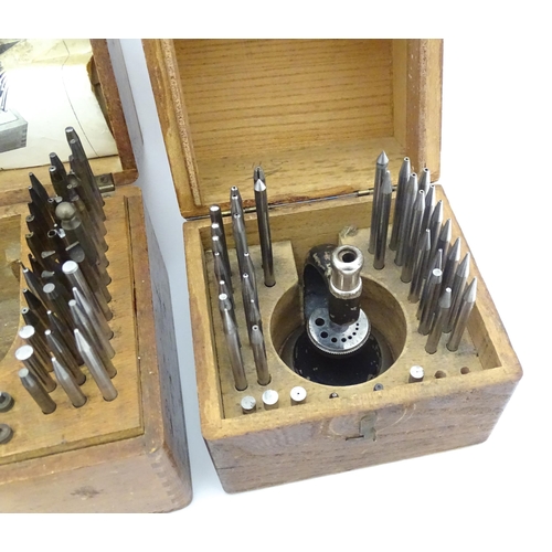 851 - Watchmakers / Repairers Equipment : Two cased watchmaker's staking tools / punches. One marked Ges C... 