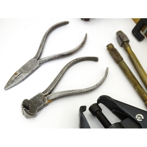 852 - A quantity of clock / watchmakers tools etc. to include gauges, pliers, clamps, files, etc., a knife... 