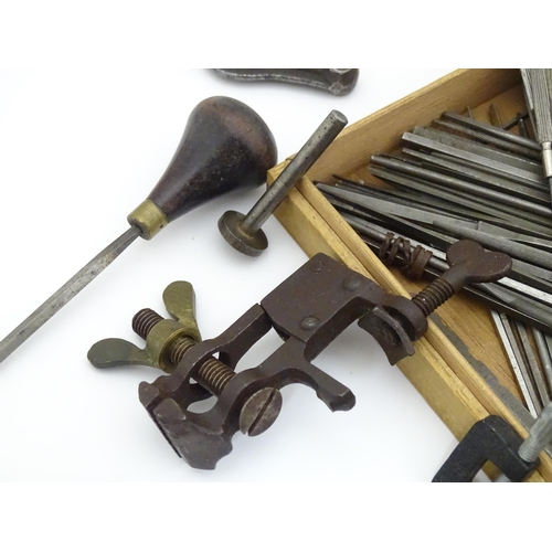 852 - A quantity of clock / watchmakers tools etc. to include gauges, pliers, clamps, files, etc., a knife... 