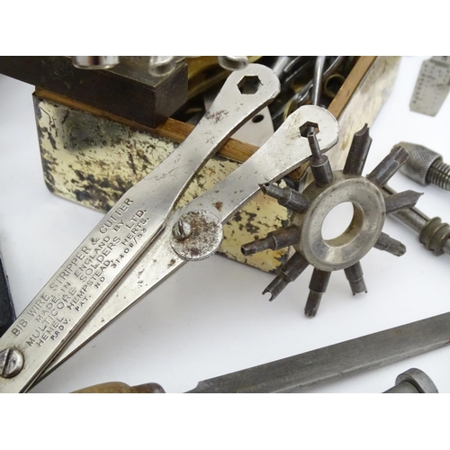 852 - A quantity of clock / watchmakers tools etc. to include gauges, pliers, clamps, files, etc., a knife... 