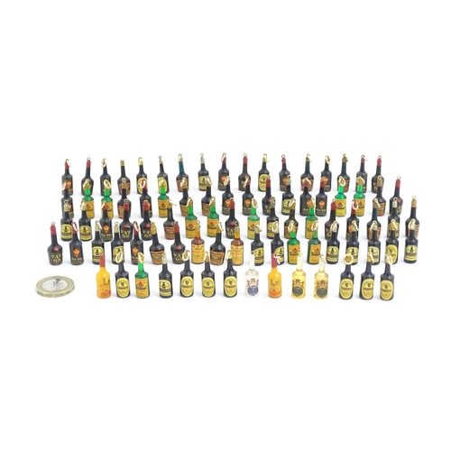 1200 - A quantity of 20thC pendant charms / fobs modelled as miniature bottles of alcohol, to include Guinn... 