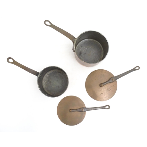 1203 - Two French Villedieu copper pans and lids with iron handles. Stamped to side. Largest approx. 14 1/2... 