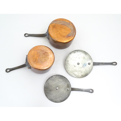 1203 - Two French Villedieu copper pans and lids with iron handles. Stamped to side. Largest approx. 14 1/2... 