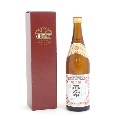 1205 - A boxed 720ml bottle of Japanese Yamamura 'Sakura Masamune' sake, the bottle approx 11 1/2