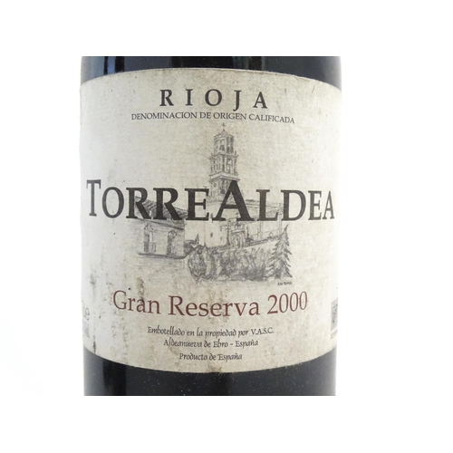 1206 - Eleven bottles of red wine, to include Torre Aldea Rioja 2000, Domaine Saint Benoit Syrah 2007, Morg... 