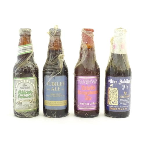 1209 - Four Royal commemorative bottles of beer / ales comprising Silver Jubilee Ale by Courage Brewing Ltd... 