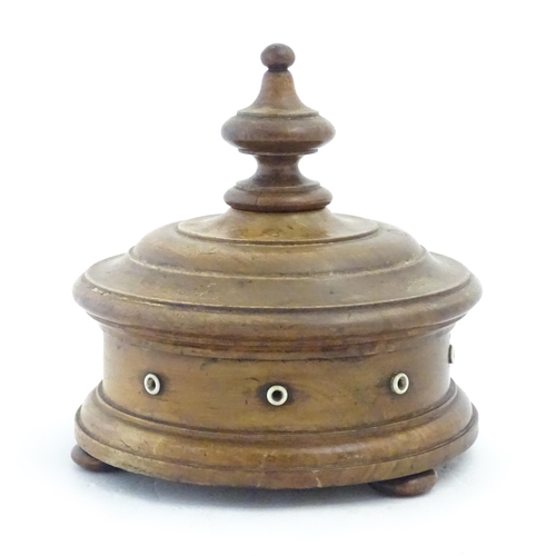 1215 - Sewing Interest: A Victorian Welsh turned walnut / treen thread box of circular form raised on three... 