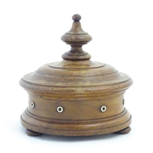 1215 - Sewing Interest: A Victorian Welsh turned walnut / treen thread box of circular form raised on three... 