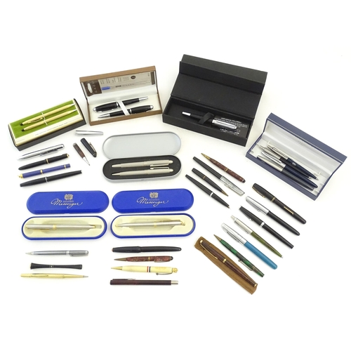 1226 - A large quantity of 20thC pens, including cased examples by Messenger, Cross and Hugo Boss and a set... 