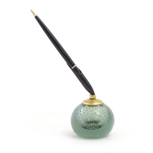 1228 - A 20thC Parker pen holder formed as a Whitefriars style glass paperweight. Approx. 9