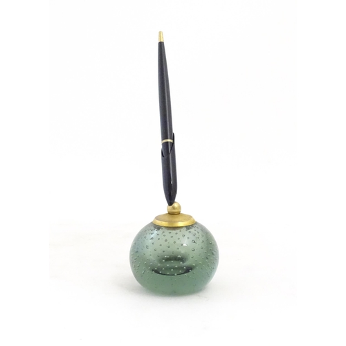 1228 - A 20thC Parker pen holder formed as a Whitefriars style glass paperweight. Approx. 9