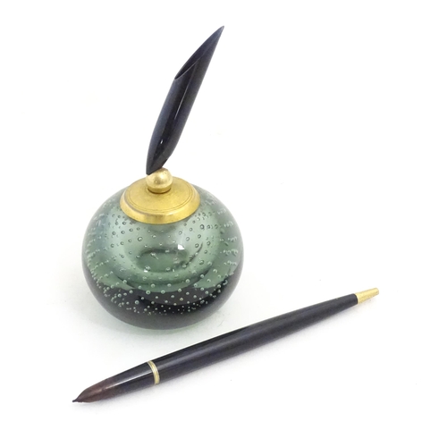 1228 - A 20thC Parker pen holder formed as a Whitefriars style glass paperweight. Approx. 9