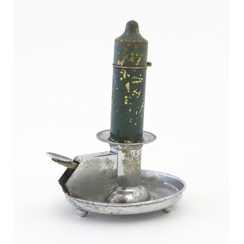 1234 - A 20thC novelty cigarette lighter modelled as a chamberstick. Approx. 5 3/4