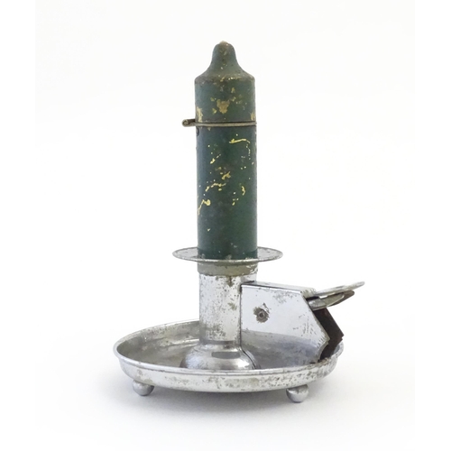 1234 - A 20thC novelty cigarette lighter modelled as a chamberstick. Approx. 5 3/4