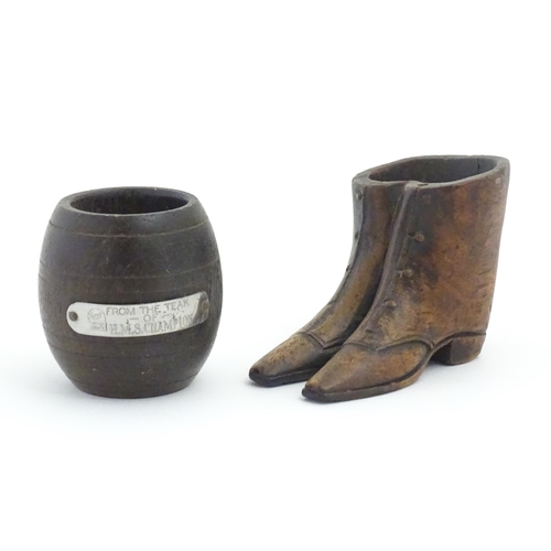 1238 - Two 20thC treen items, comprising a carved vesta / snuff pot modelled as a pair of boots, and pot of... 