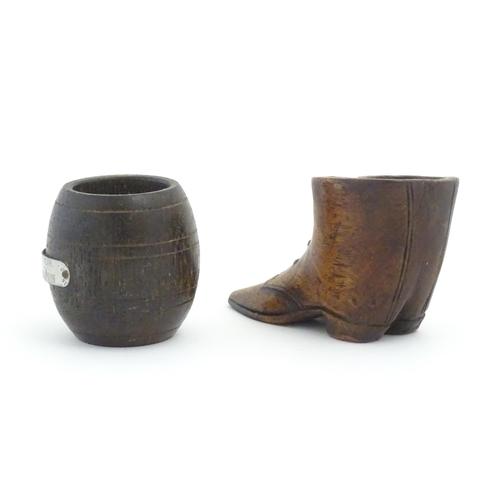 1238 - Two 20thC treen items, comprising a carved vesta / snuff pot modelled as a pair of boots, and pot of... 