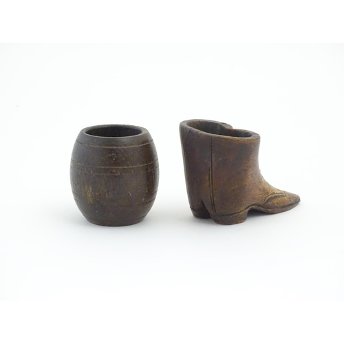 1238 - Two 20thC treen items, comprising a carved vesta / snuff pot modelled as a pair of boots, and pot of... 