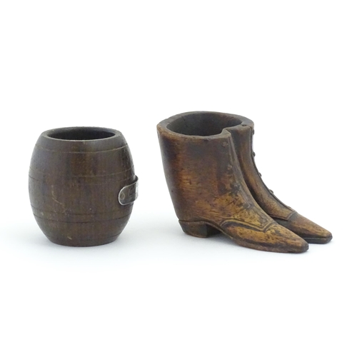 1238 - Two 20thC treen items, comprising a carved vesta / snuff pot modelled as a pair of boots, and pot of... 