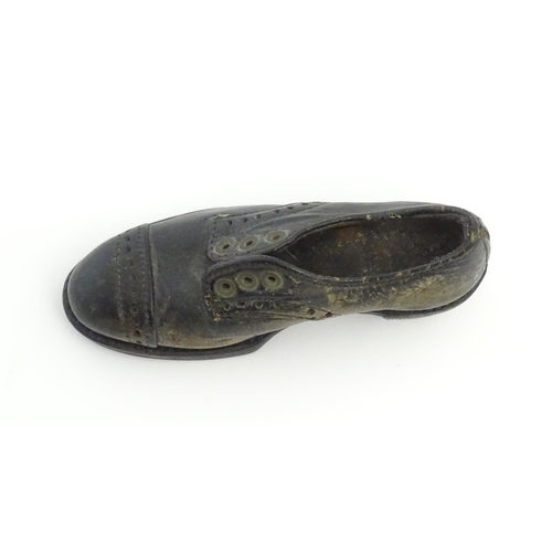 1239 - An early 20thC cobbler's apprentice piece model of a shoe. Approx. 3 3/4