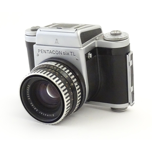 1244 - A Pentacon Six TL camera with two Carl Zeiss Jena lenses - 2.8/80 biometar and 4/50 Flektagon (cased... 