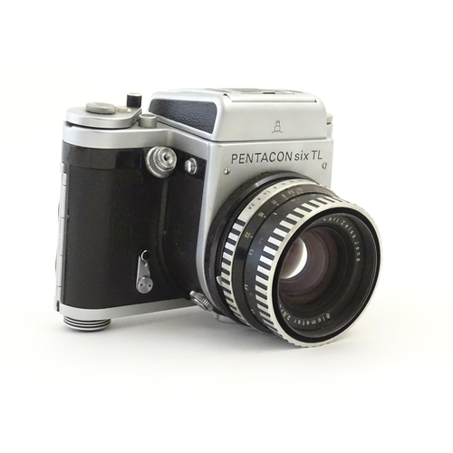 1244 - A Pentacon Six TL camera with two Carl Zeiss Jena lenses - 2.8/80 biometar and 4/50 Flektagon (cased... 