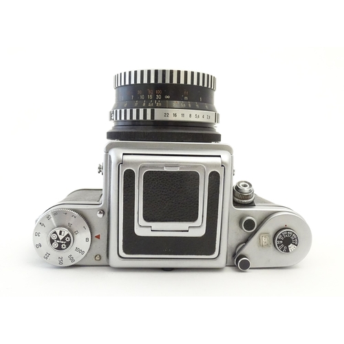 1244 - A Pentacon Six TL camera with two Carl Zeiss Jena lenses - 2.8/80 biometar and 4/50 Flektagon (cased... 