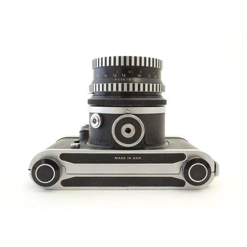 1244 - A Pentacon Six TL camera with two Carl Zeiss Jena lenses - 2.8/80 biometar and 4/50 Flektagon (cased... 