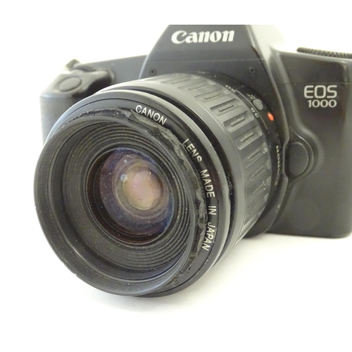 1245 - A Canon EOS 1000 camera with a 35-80mm f/4-5.6 lens.