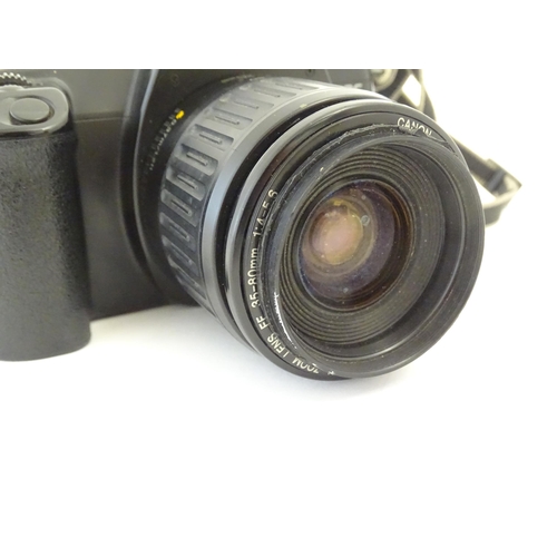 1245 - A Canon EOS 1000 camera with a 35-80mm f/4-5.6 lens.