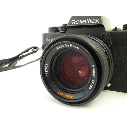 1246 - A Rolleiflex SL35 E 35mm film camera, c1970s, cased with lens cap. 5 1/8