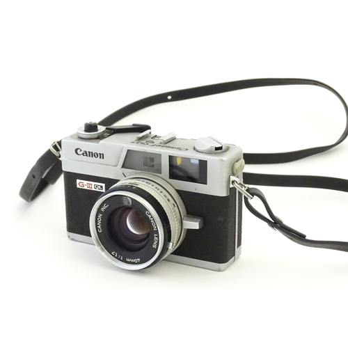 1247 - A Canon Canonet G-III QL17 35mm film camera, c1972, cased with lens cap. Approx 4 5/8