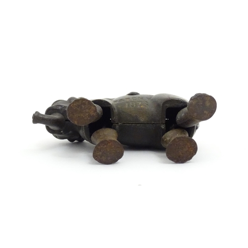 1464 - Toy: A late 19thC cast iron walking elephant toy with articulated legs and trunk, by the Ives Toy Co... 