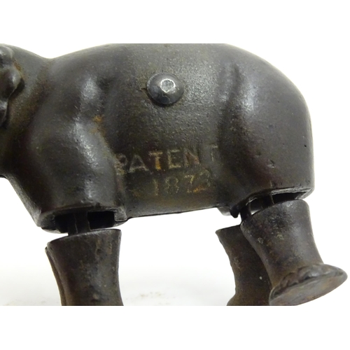 1464 - Toy: A late 19thC cast iron walking elephant toy with articulated legs and trunk, by the Ives Toy Co... 