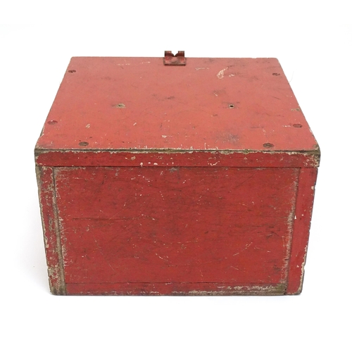 1311 - A 20thC industrial case, of plywood construction with red painted finish, the fall front marked 'Det... 