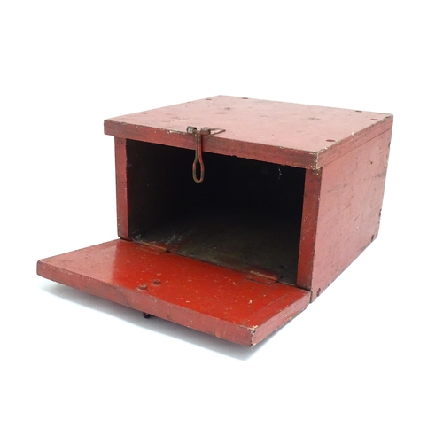 1311 - A 20thC industrial case, of plywood construction with red painted finish, the fall front marked 'Det... 