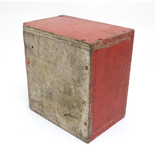 1311 - A 20thC industrial case, of plywood construction with red painted finish, the fall front marked 'Det... 