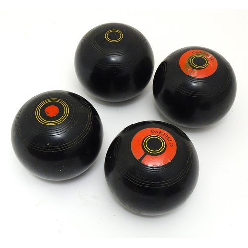 1312 - Lawn Bowls Interest: Four 20thC lawn bowls, a pair of lawn bowls shoes and a Terry Bowls Measure. Co... 