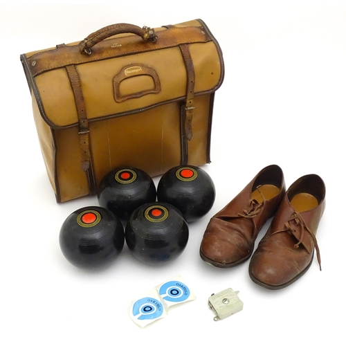 1312 - Lawn Bowls Interest: Four 20thC lawn bowls, a pair of lawn bowls shoes and a Terry Bowls Measure. Co... 