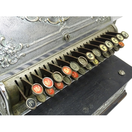 1316 - An early 20thC American cash register with floral and foliate decoration, by the National Cash Regis... 