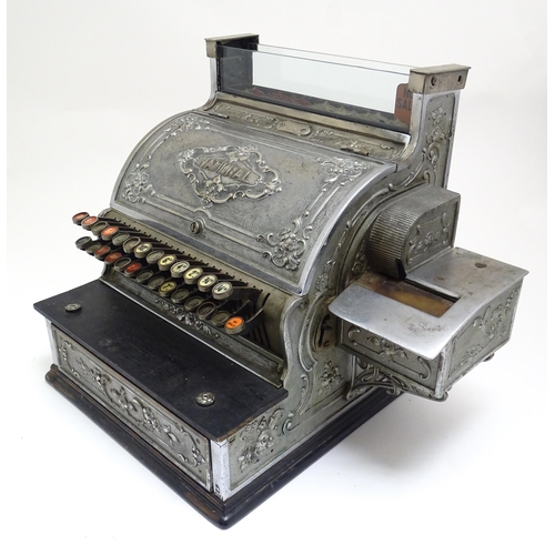 1316 - An early 20thC American cash register with floral and foliate decoration, by the National Cash Regis... 