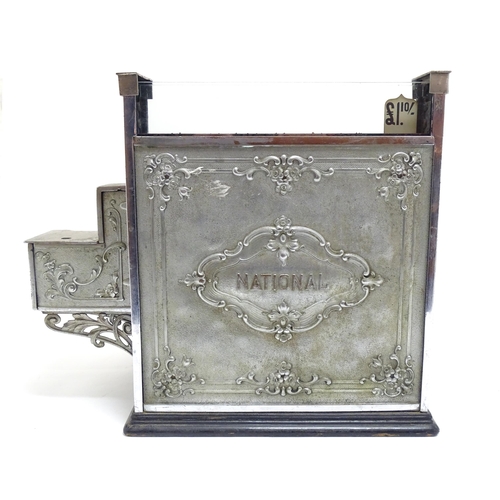 1316 - An early 20thC American cash register with floral and foliate decoration, by the National Cash Regis... 