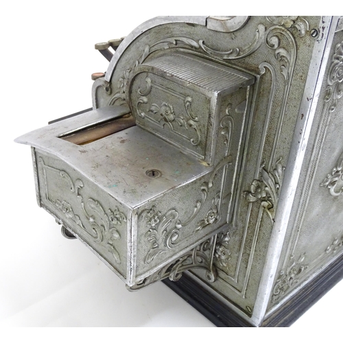 1316 - An early 20thC American cash register with floral and foliate decoration, by the National Cash Regis... 