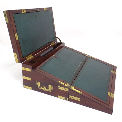 1318 - A 19thC mahogany brass bound writing box / slope with campaign style handles, drawer to side and thr... 