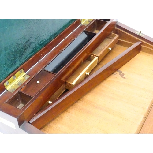 1318 - A 19thC mahogany brass bound writing box / slope with campaign style handles, drawer to side and thr... 