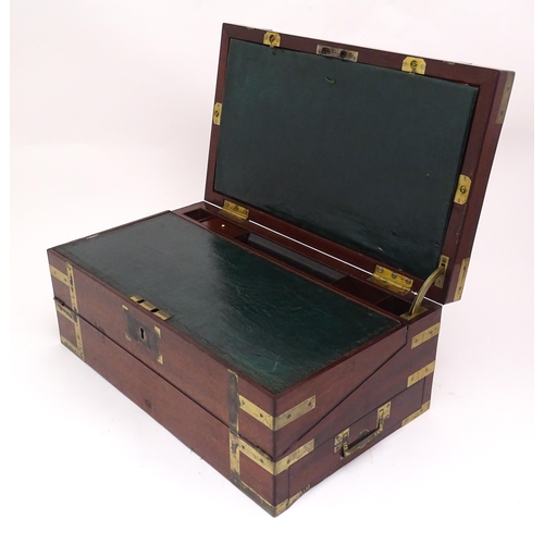 1318 - A 19thC mahogany brass bound writing box / slope with campaign style handles, drawer to side and thr... 