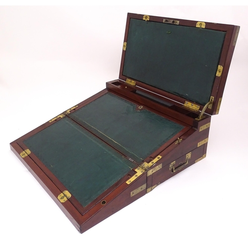 1318 - A 19thC mahogany brass bound writing box / slope with campaign style handles, drawer to side and thr... 