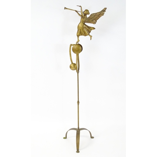 1320 - An unusual late 20thC gilt metal stand with a triform base supporting a perpetual motion / counter b... 